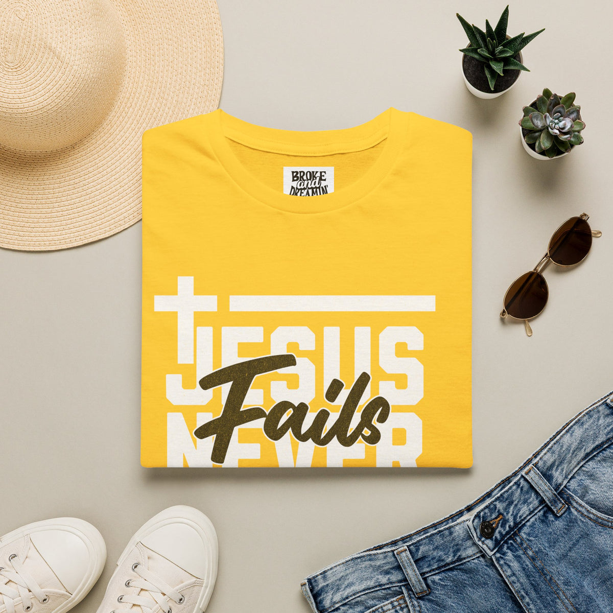 "Jesus Never Fails” Unisex T-Shirt - Broke & Dreamin' T-Shirts